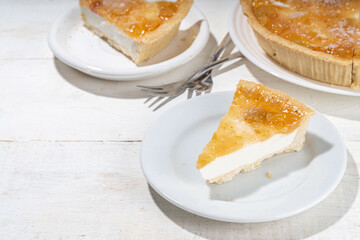 Homemade caramel apple pie cheesecake, sweet cheese  apple cake with caramelized apple sauce