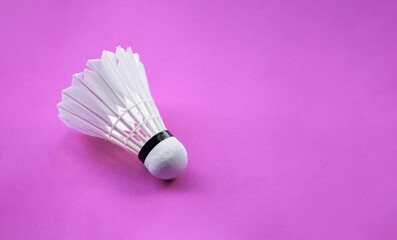Fototapeta na wymiar White cream badminton shuttlecock on background, concept for recreational activity in free time in daily life.