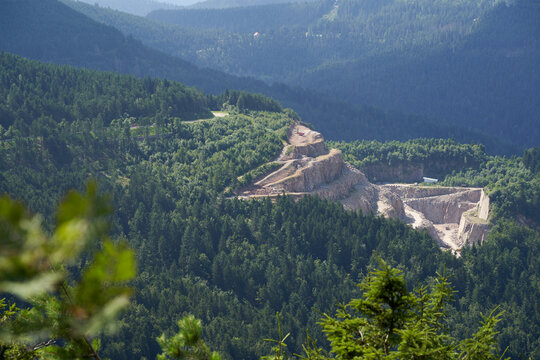 VSG quarry in the northern Black Forest below the mountain hornisgrinde. Green twigs in the foreground. High angle view. Germany, Hornisgrinde.