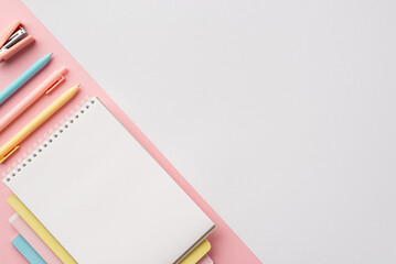 Back to school concept. Top view photo of color stationery copybooks pens and mini stapler on...