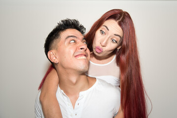 couple in love, young latin man, redhead woman, funny, smiles
