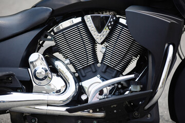 Fototapeta premium motorcycle motor closeup. motorbike engine block. Luxury modern chrome Chopper Engine photography . Rock lifestyle. Power and freedom