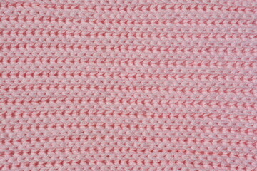 A background of hand-knitted knitted fabric with an 