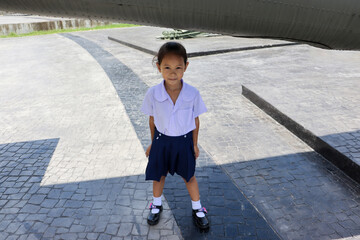 little girl wearing a school uniform Come to see the plane - Thailand