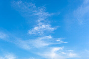 Naklejka na ściany i meble Sky blue background, light clouds in the blue sky