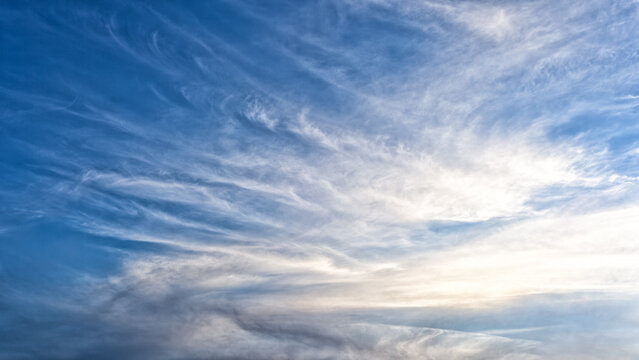 White, fluffy clouds in blue sky. Background from clouds, beautiful Hi rez Sky