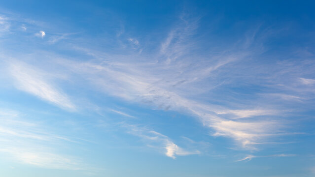 White Fluffy Clouds On Blue Clear Sky