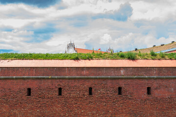 Defensive walls of the city of Zamość. Church in the background. Zamosc, Poland