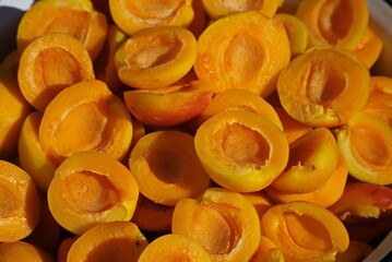 Slices of Ripe yellow apricots close-up, top view