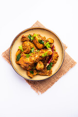 Sukha mutton or chicken, dry spicy Murgh or goat meat served in a plate or bowl