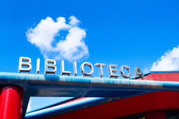 Public library sign, where students gather to study and people to read books