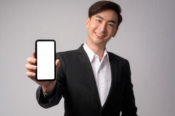 Young businessman wearing  suit over white background studio