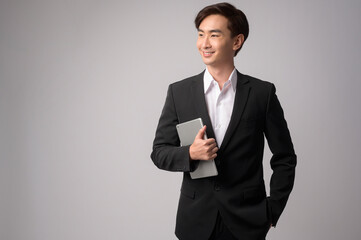 Young businessman wearing  suit over white background studio