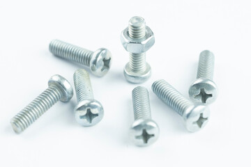 Group of screw-bolts isolated on white. Standing out of the crowd concept.