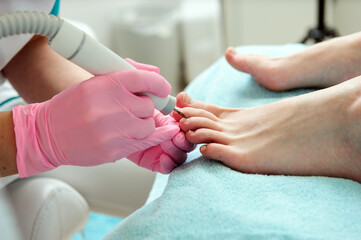 Pedicure procedure.Close up hands.Foot care.Using tools.