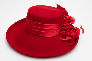 Studio photo of a red vintage hat. The background is white. - obrazy, fototapety, plakaty
