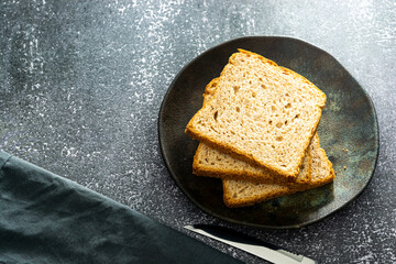 slices of loaf bread or whole bread with natural fermentation, in a breakfast scene or afternoon coffee break with butter