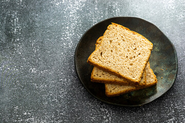 slices of loaf bread or whole bread with natural fermentation, in a breakfast scene or afternoon coffee break with butter
