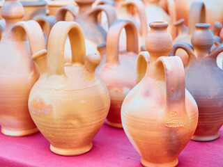 Fototapeta na wymiar Different handmade ceramic pots for sale