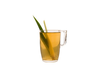 House-made hot lemon grass pandan tea served in a cup isolated on plain white background side view