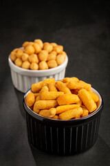 Snacks in ramekin on the table.