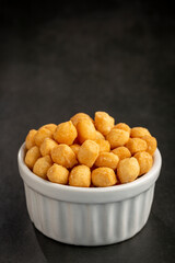 Snacks in ramekin on the table.