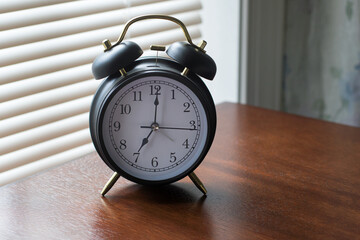 Old alarm clock on the table