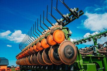 Row seed drill grain. Seed sowing device. Agricultural activity. Close up. Modern modified...