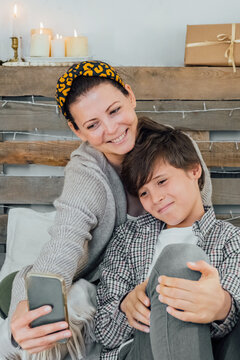 Candid happy family having fun together mother with son taking phoros on mobile. Family. online congratulations.