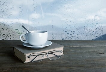 A cup of coffee with book. Stay home and relaxing concept.