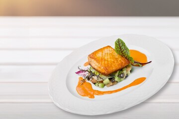 Tasty fish fillet on a white plate