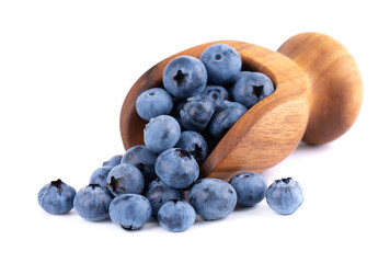 Fresh blueberry in wooden scoop, isolated on white background. Bilberry or whortleberry.