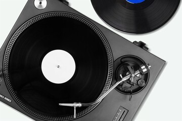 Classic and analog turntable for playing vinyl records. Model for a DJ concept