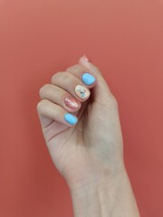 Nail polish gel polish, manicure with a coating in modern style. coconut manicure. summer manicure nail treatment, colored varnish. aesthetics beauty, female grooming, salon. place for text