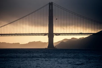 Papier Peint photo Plage de Baker, San Francisco Golden Gate bridge at sunset on a cloudy day