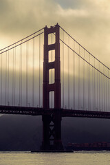 Fototapeta na wymiar Golden Gate bridge at sunset on a cloudy day