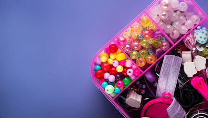 A set of beads of various shapes in a box for creating bracelets and jewelry. DIY