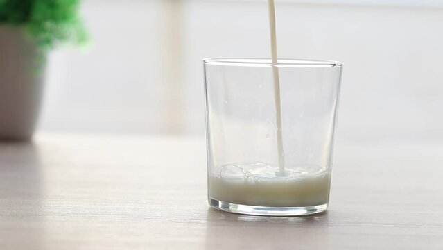 milk pouring into the glass, dairy