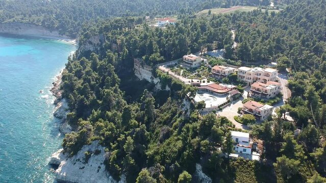 Panoramic aerial view over Milia beach with seaside hotels and resorts in Alonnisos island, Greece.