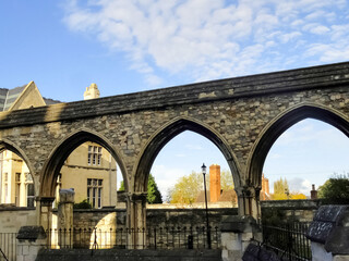 Old houses and arched construction in the old part In Gloucester