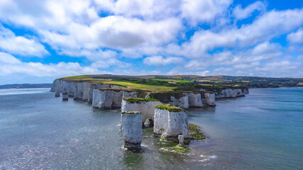 Fototapeta na wymiar Old Harry Rocks are three chalk formations, including a stack and a stump, located at Handfast Point, on the Isle of Purbeck in Dorset, southern England. They mark the most eastern point of the Jurass