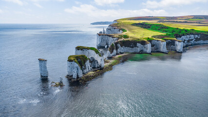 Old Harry Rocks are three chalk formations, including a stack and a stump, located at Handfast...
