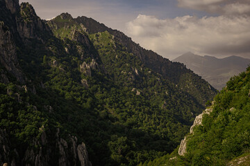 Fototapeta premium Beautiful landscape in mountains with clouds in Italy