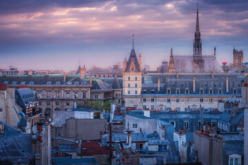 Saint Chapelle and quarter latin roofs at golden sunrise Paris, France