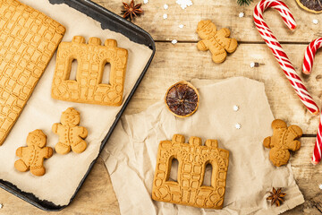 Christmas Gingerbread House and Gingerbread Men. Traditional New Year design, cooking process