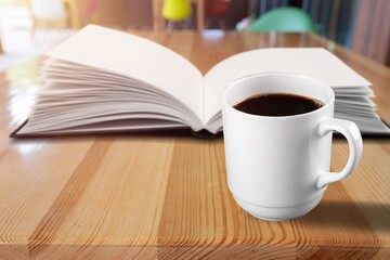 Reading book at home with a cup of coffee. Relaxation mood, cultural activity. Freedom, information, knowledge concept.