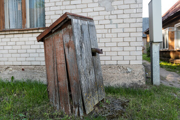 Old water pump insulated in wooden box, Subate, Latvia.