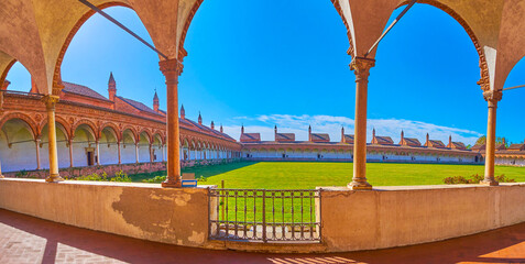Panorama of the Grand Cloister with covered arcaded gallery of Certosa di Pavia, Italy