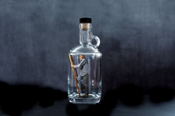 Man trapped in an empty bottle, climbing a ladder, looking for an exit