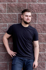 Young stylish man with fashion haircut after visiting barbershop